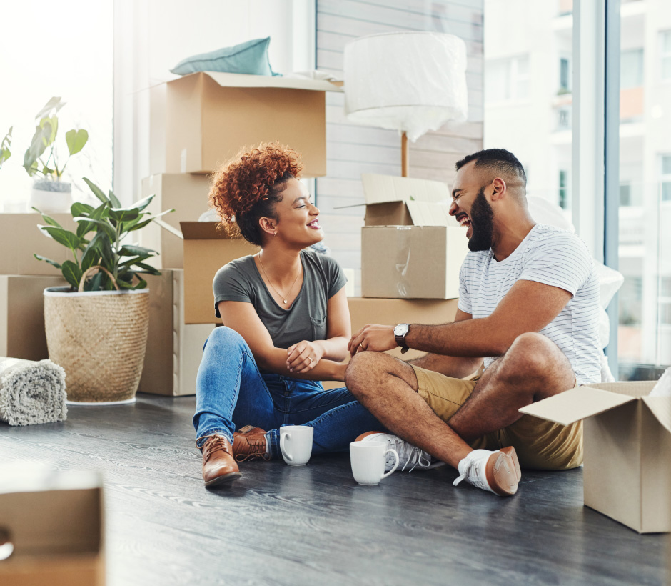 couple unpacking boxes