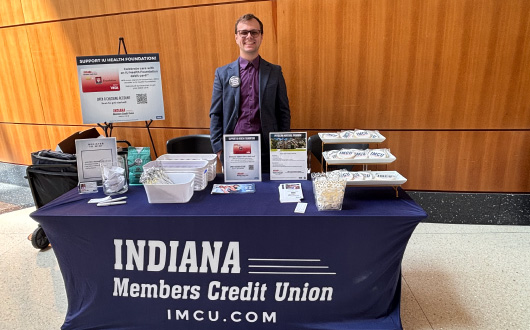 person behind IMCU table