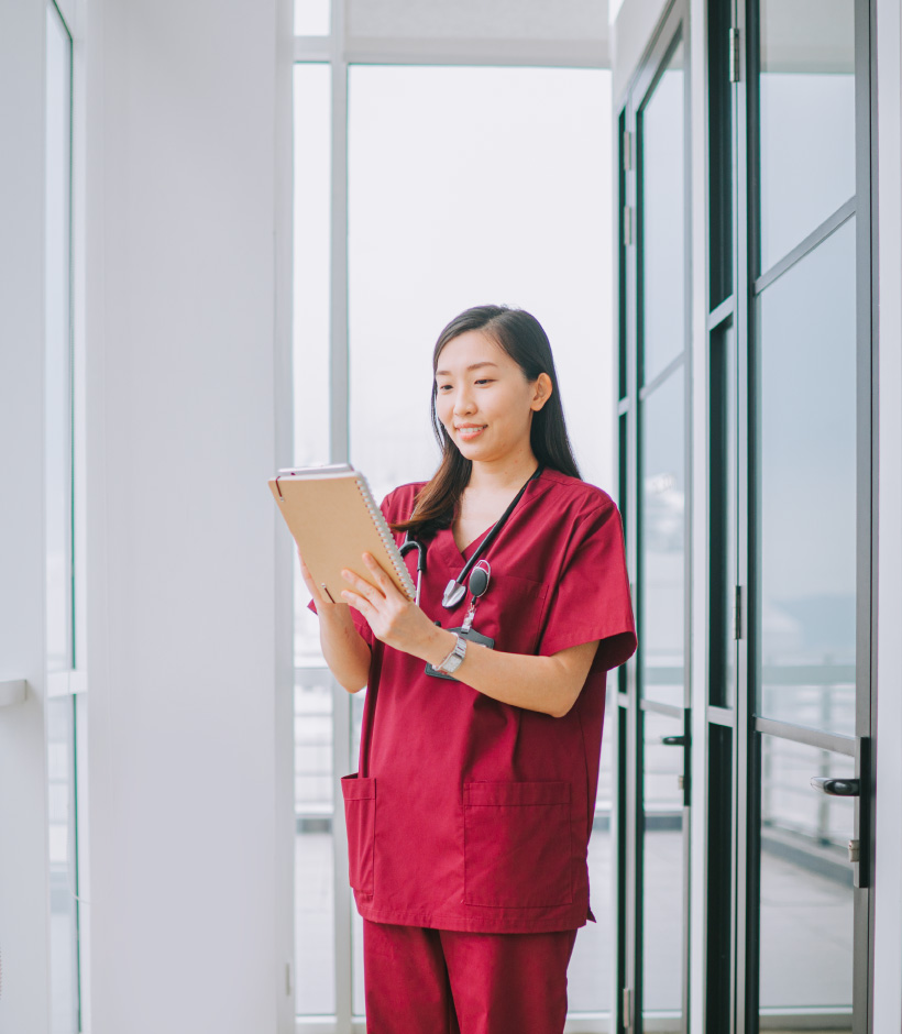 nurse looking at tablet