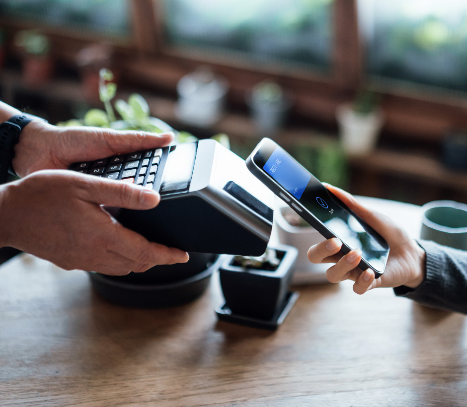 person tapping to pay with phone