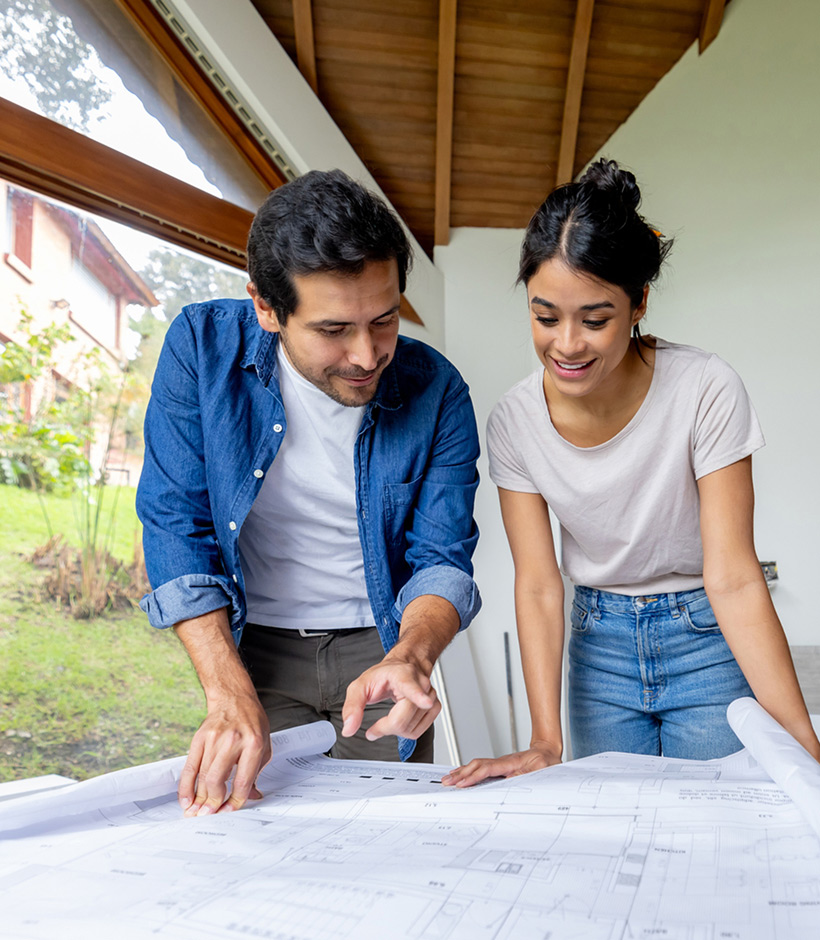 couple looking over blueprints 