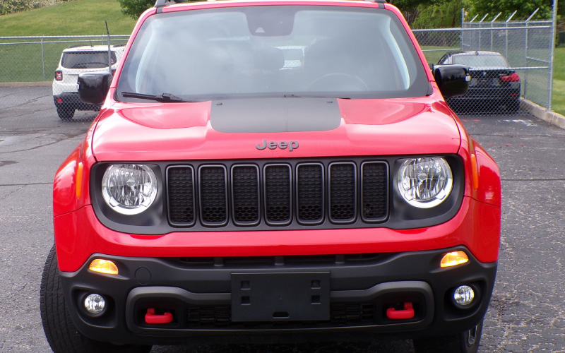 front of red suv
