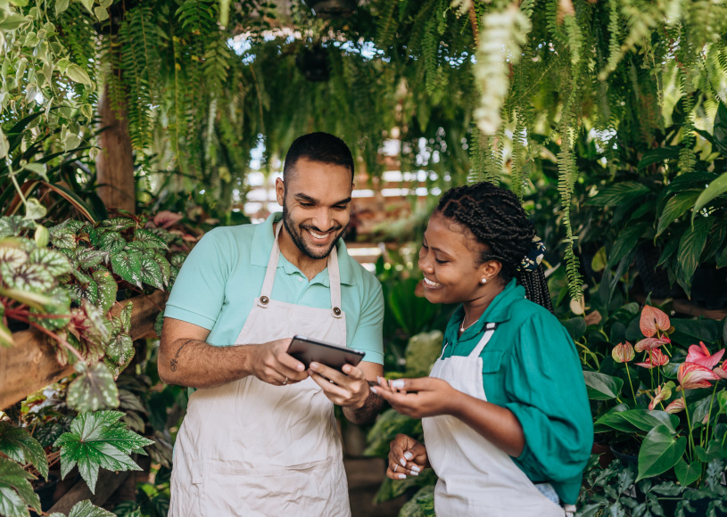 two people look at a tablet