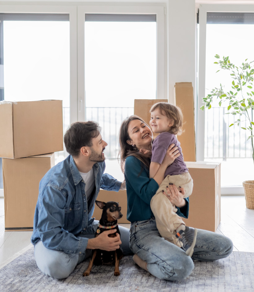 family in front of boxes