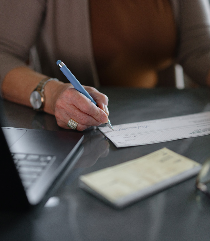 person writing a check
