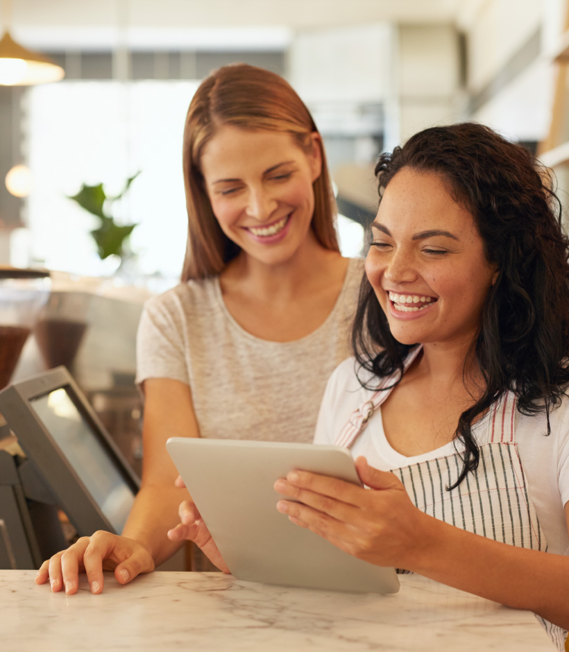 two people looking at laptop