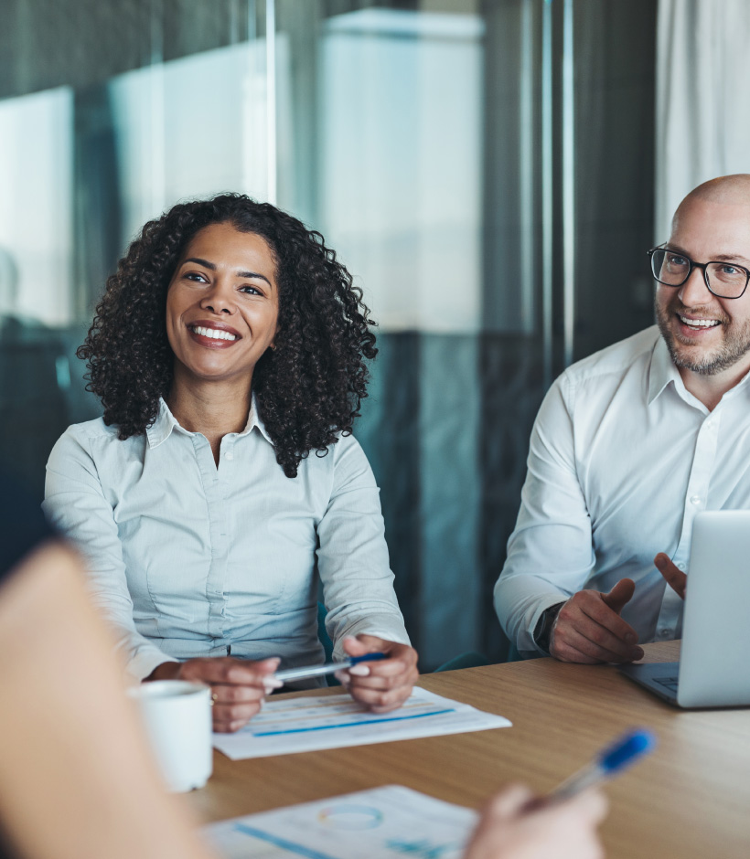 people listening at business meeting