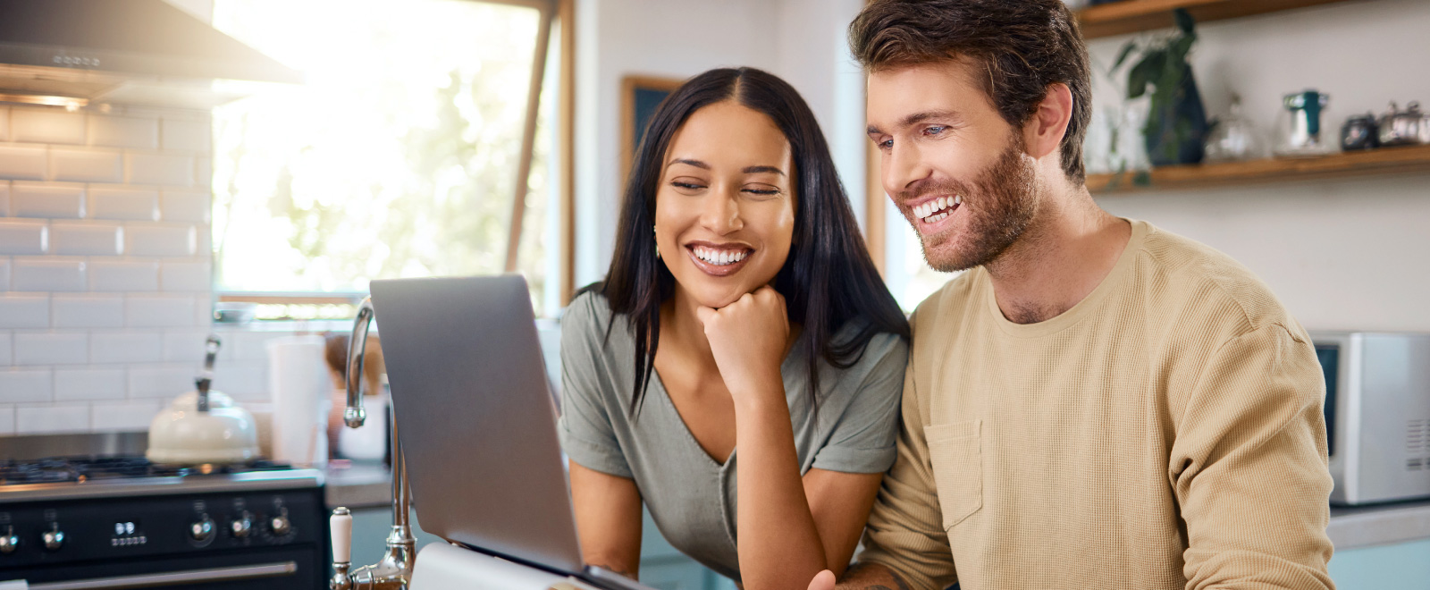 Young couple looking at laptop