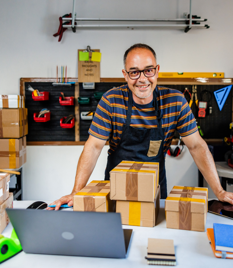 person with shipping boxes