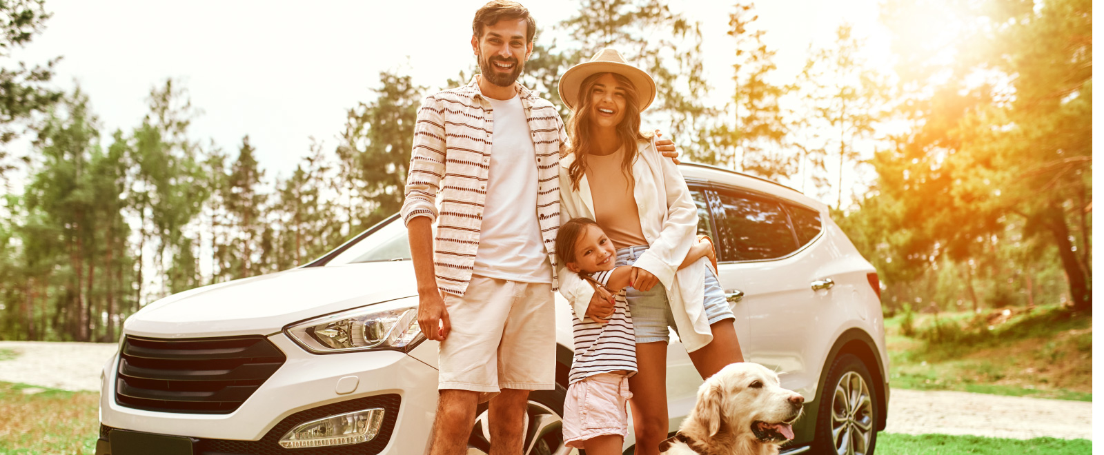 Family and dog with car