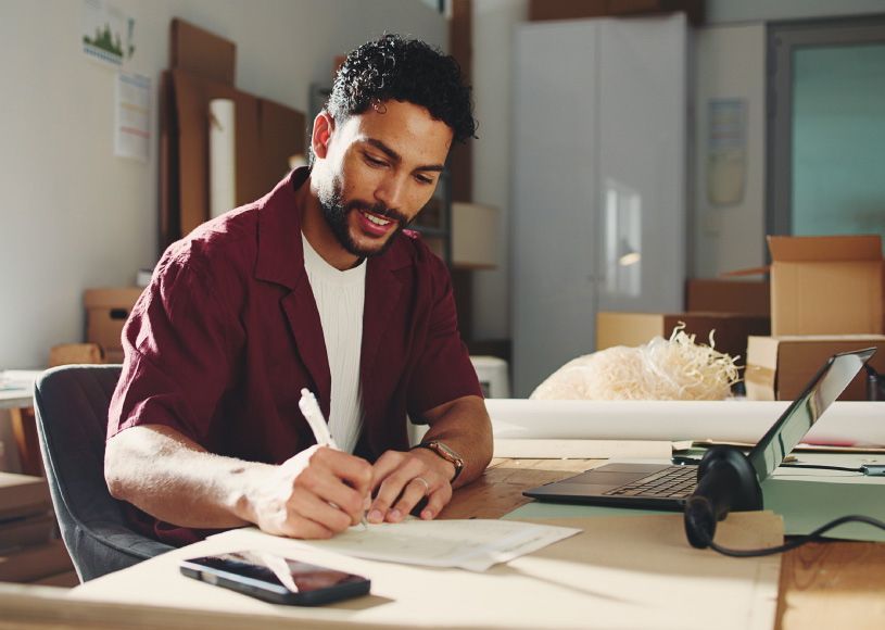 person writing on paper