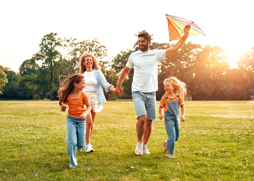family playing with kite