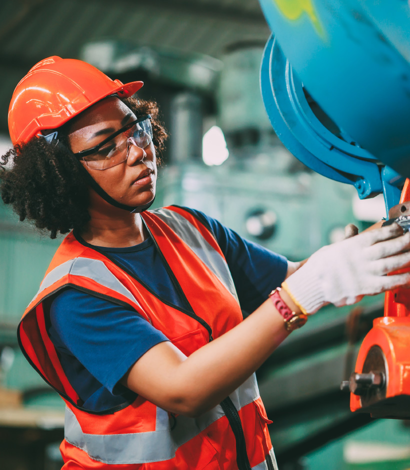 person in hard hat working machinery