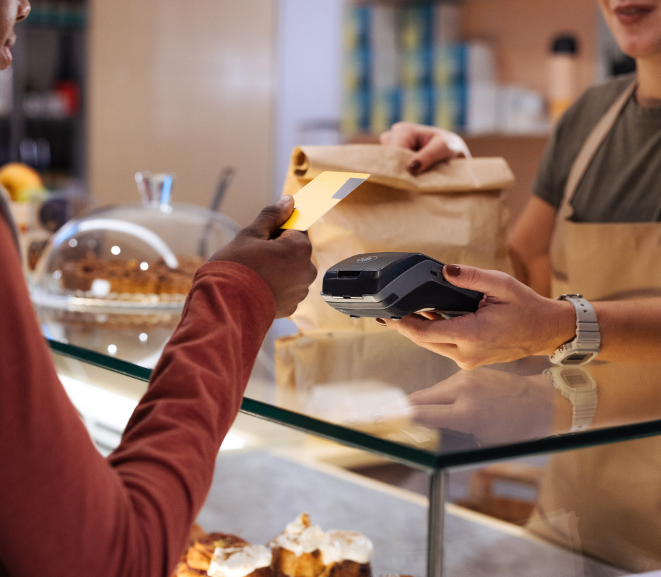 person tapping to pay with card