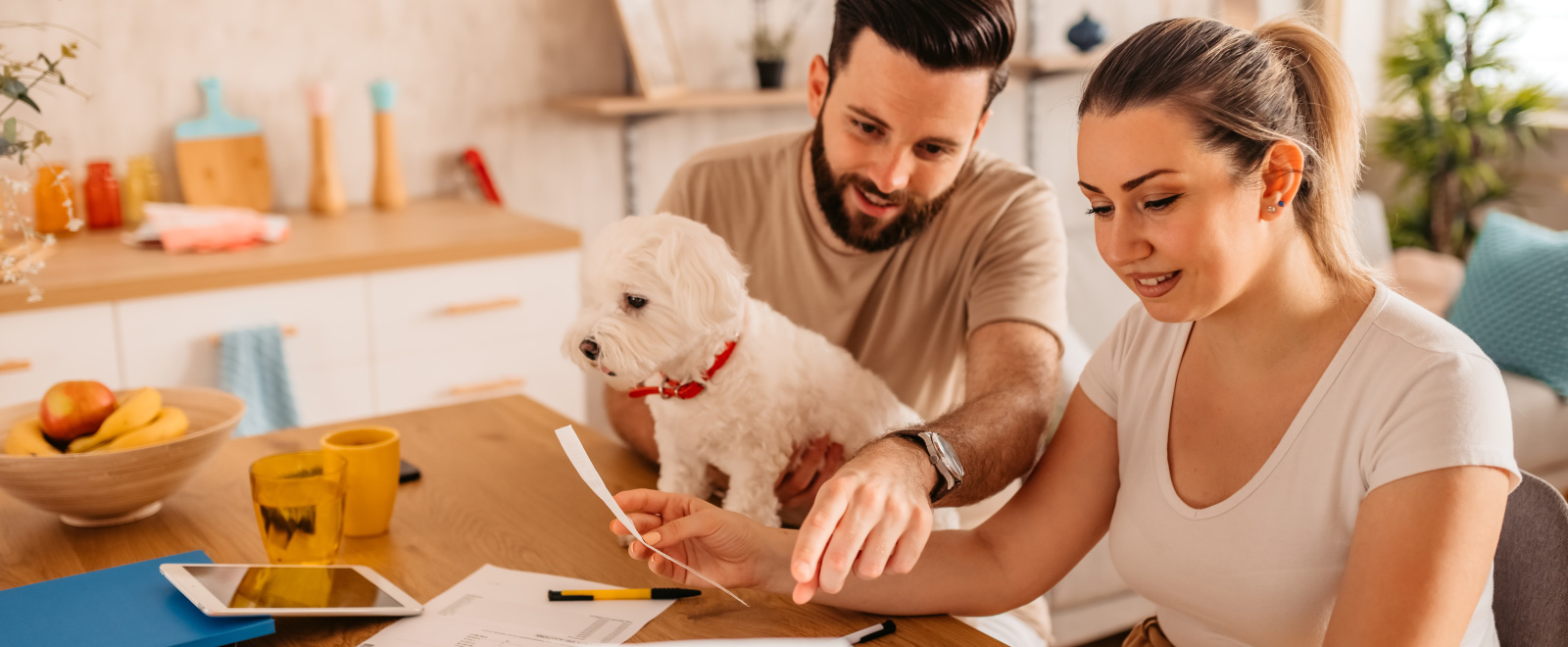 Couple with dog looking at finances