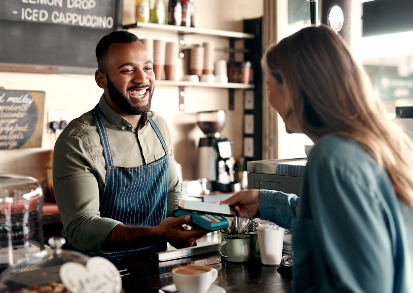 person tapping to pay with phone