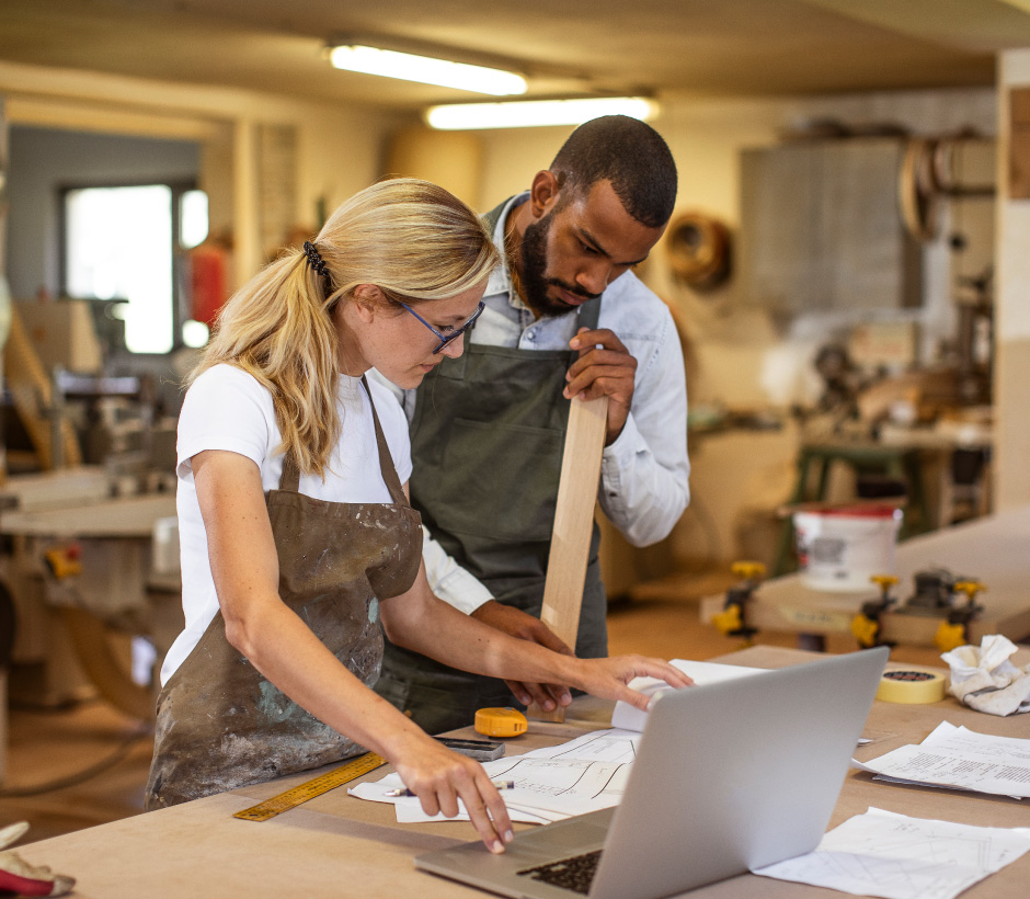 couple looking at blue prints 