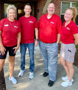 four employees volunteering