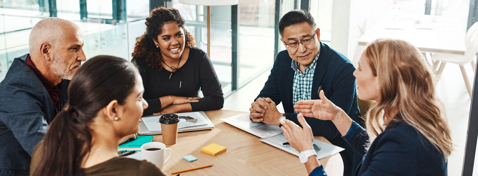 Business professionals having meeting at table