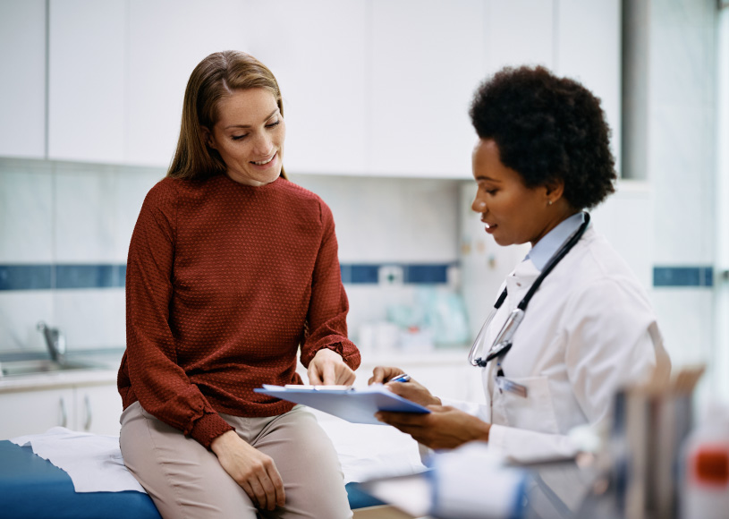 doctor and person looking at a clipboard