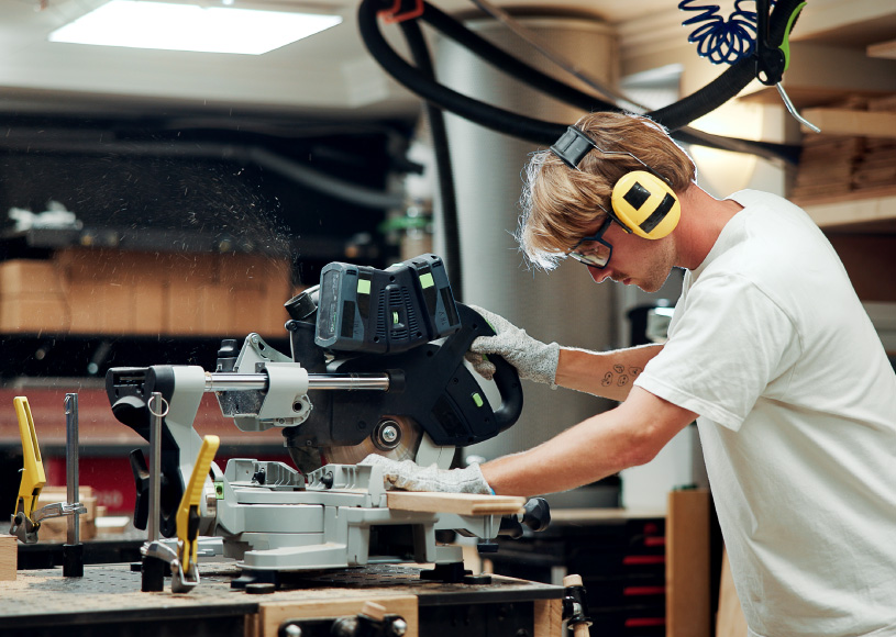 person working on a saw
