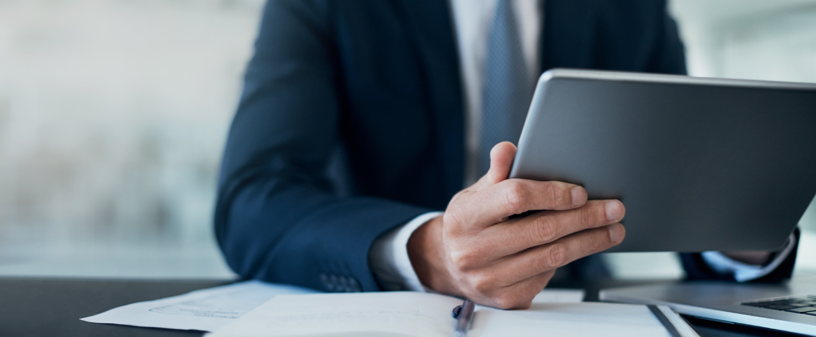 A businessman using a tablet device